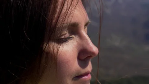 Close up of woman's face at sunset, beautiful green eyes, portrait Stock Footage 124715632