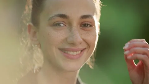 Close up of woman's face at sunset, beautiful green eyes, portrait, outdoor Stock Footage 199102915