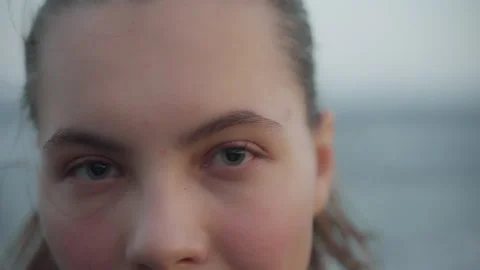 Close up of woman's face at sunset, beautiful blue eyes, portrait, outdoor relax Stock Footage 252750220