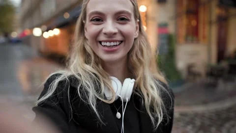 Close up of woman's face, using smart phone, recording selfie, wile talking on Stock Footage 143540149