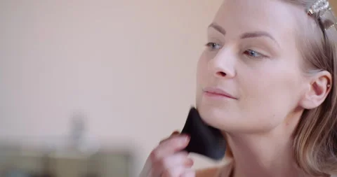 Close up of woman's face while applying makeup Stock Footage 305062598