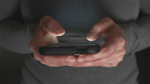 Close-up of a woman's fingers using the screen of a mobile phone, smartphone. Stock Footage 229961018