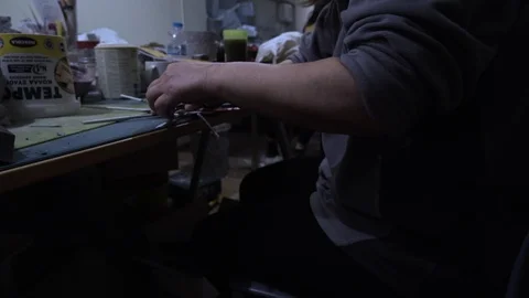 Close up of woman's fingers while she is upcycling a Shedia ma Stock Footage 119275655