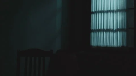 Close-up of a woman's ghostly shadow appears in a dark room, USA - Reenactment Stock Footage 239376726