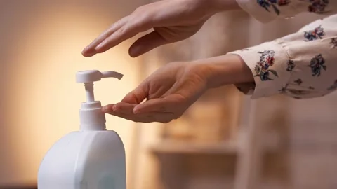 Close-up of a woman's hand and hand sanitizer. Stock Footage 132076181