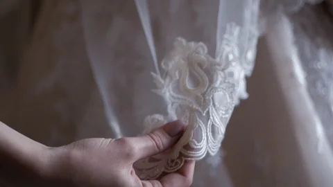 Close-up of a woman's hand correcting a wedding dress Stock Footage 109203841