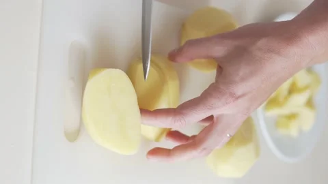 Close-up, a woman's hand cuts a knife into cubes Stock Footage 234407808