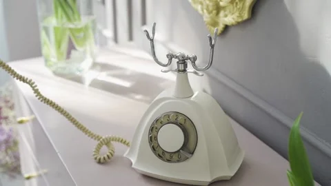 Close-up of woman's hand dialing number on an old retro phone with round disk Stock Footage 172142739