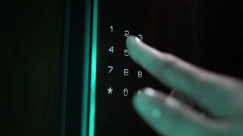 Close-Up of a Woman's Hand Entering a Code on an Electronic Lock Stock Footage 304827786