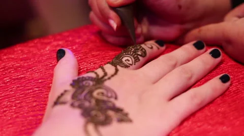 Close up of a Woman's Hand getting a Henna Tattoo Stock Footage 48597561