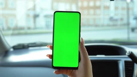 Close up of a woman's hand holding a mobile telephone with a vertical green Stock Footage 140626618