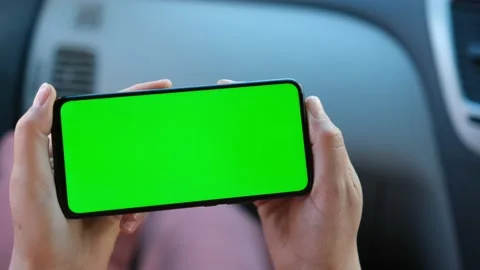 Close up of a woman's hand holding a mobile telephone with a horizontal green Stock Footage 155200341