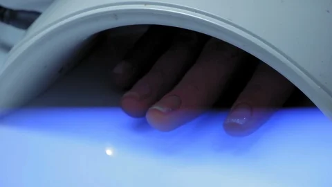 Close-Up, Woman's Hand with Nails Painted with Protective Varnish Layer under Stock Footage 97958941
