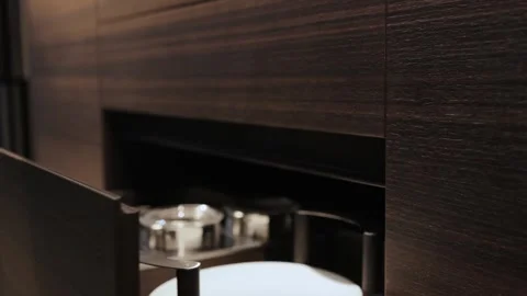Close-up of a womans hand opening an empty kitchen drawer. Stylish kitchen with Stock Footage 314270302