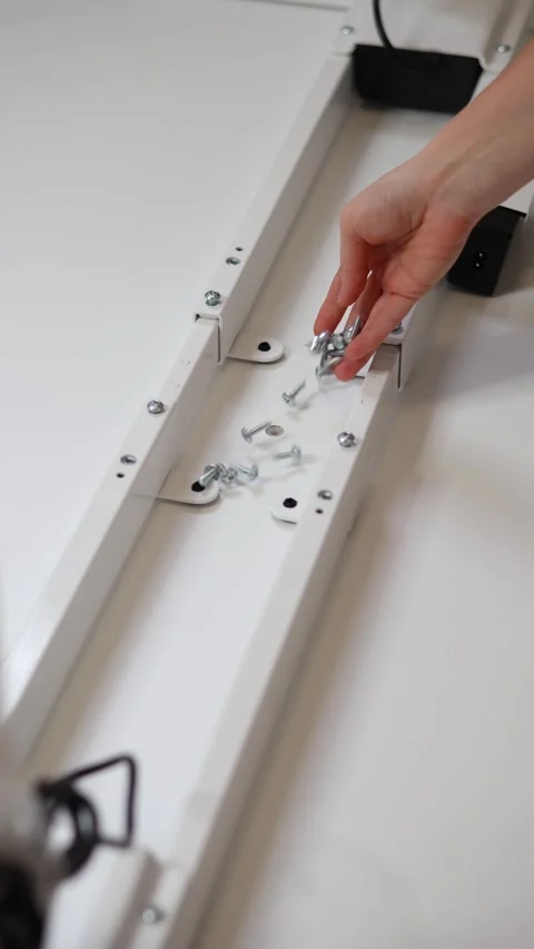 Close-up of a woman's hand picking up bolts and screws Stock Footage 293102804