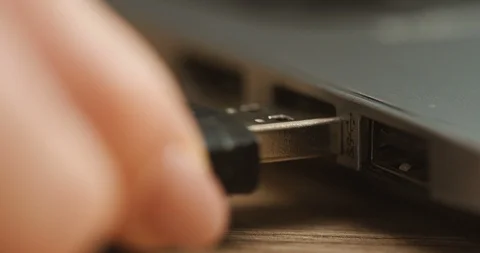 Close up of the woman's hand putting the flash card in the black laptop computer Stock Footage 86434705