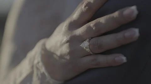 Close-up of woman’s hand with ring on man’s shoulder Stock Footage 328256448