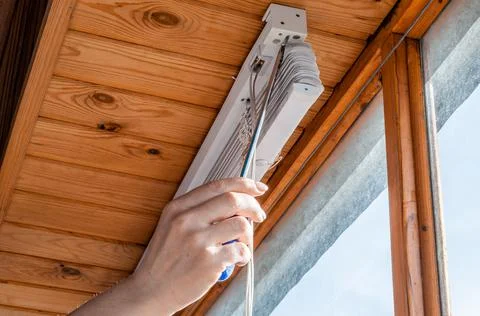 Close-up of a woman's hand with a screwdriver Stock Photos