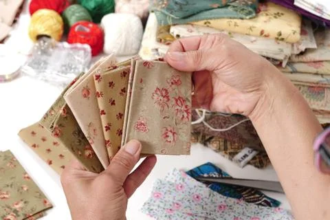 Close up of woman's hand sewing patchwork 스톡 사진