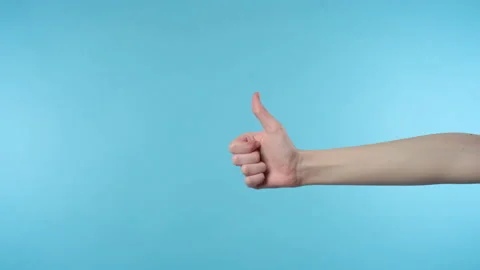 Close up of woman's hand showing thumb up sign Stock Footage 171540752