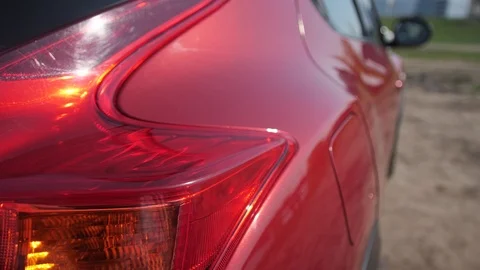 Close up. The woman's hand slides gently along the car's body. 4K Slow Mo Stock Footage 107827321