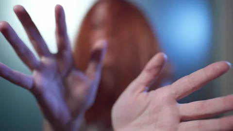 Close-up of a woman's hand slowly performing a gesture in an attempt to reach Stock-Footage 161061974