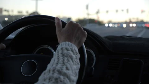 Close up of a woman's hand on the steering wheel while driving Stock Footage 234154682