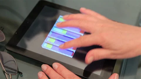Close-up of a woman's hand on a Tablet PC. Tracking shot. Stock Footage