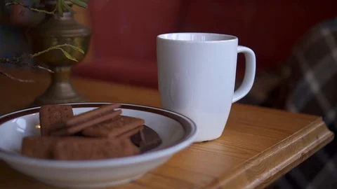 Close-up of woman's hand taking cup of tea from table Stock Footage 119340212