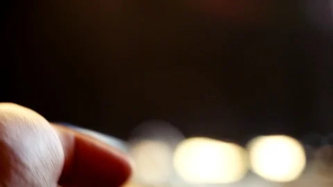 Close up of woman's hand with a television remote control changing channels Stock Footage 71794397