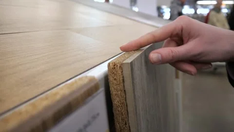 Close-up of a woman's hand touching  sample of tiles Stock Footage 304807890