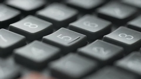 Close-up of a woman's hand using a calculator Stock Footage 158909882