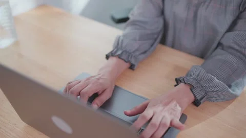 Close-up of a woman's hand using an important laptop Female hands typing on lapt Stock Footage 276723735