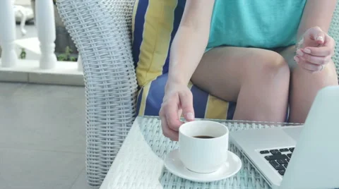 Close up of woman's hand while drinking coffee outdoors. 動画素材 51189789