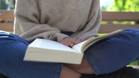 Close up the woman's hand while reading the book Stock Footage 142351822
