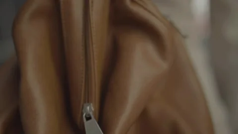 Close-up of woman's handbag while walking in street Vídeos de archivo 334049945