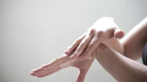 Close-up of a woman's hands applying cream Stock Footage 242627481