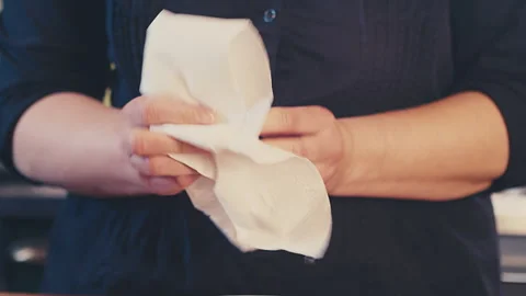 Close up of woman's hands cleaning, and wiping dry a whole fresh lemon with Stock Footage 272924711