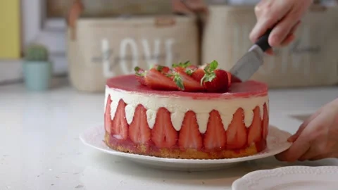 Close-up of a woman's hands cuts a fresh strawberry cake Stock Footage 245424305
