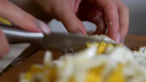 Close up of woman's hands cutting boiled chicken egg  Stock Footage 168540101