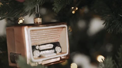 Close-up of woman's hands decorating Christmas tree Stock Footage 166544318