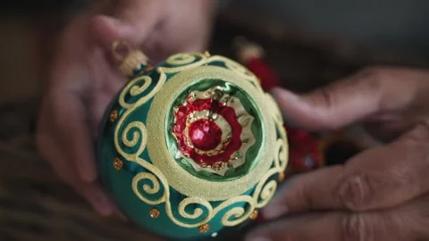 Close-up of woman's hands decorating Christmas tree wist antique retro toy Stock Footage 166545359