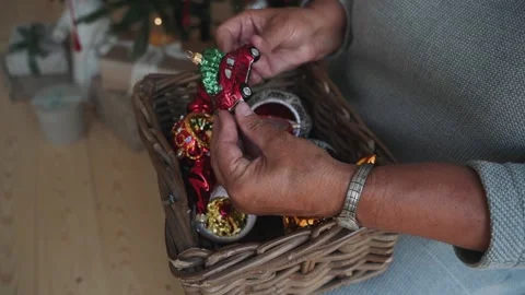 Close-up of woman's hands decorating Christmas tree with retro car toy Stock Footage 166545430
