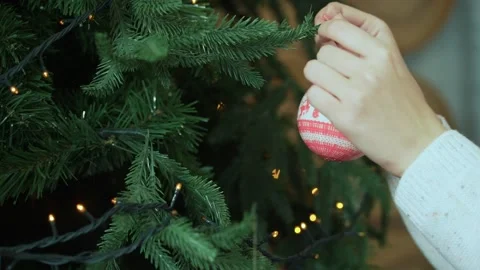 Close-up of  Woman's hands decorating Christmas tree. Stock Footage 222033739