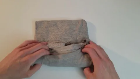 Close-Up Woman's Hands Folding Grey T-Shirt Marie Kondo Style Видео 84999516