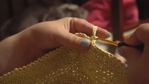 Close up on woman's hands knitting 4k. Knitting a straw product by female hands Stock Footage 198241226