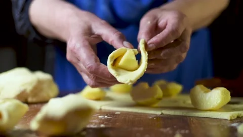 Close up of woman's hands make a apple pie. Slow Motion shot Stock Footage 130531142