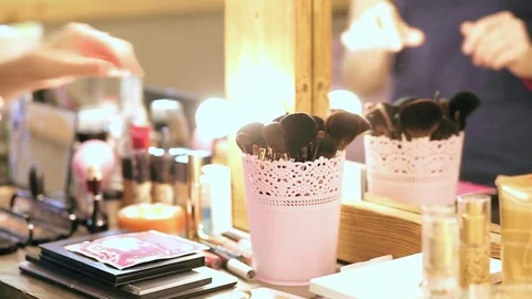 Close up of woman's hands with makeup powder brush Video stock 76085800