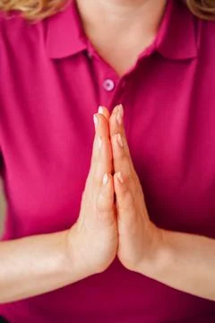 Close up of woman's hands with palms together in prayer position Stock Photos
