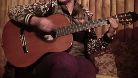 Close up of woman's hands playing the guitar. Musical evening. Stock Footage 141465741